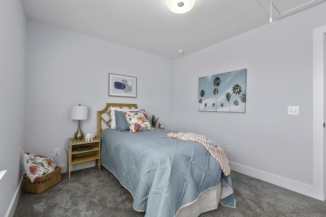 carpeted bedroom featuring baseboards