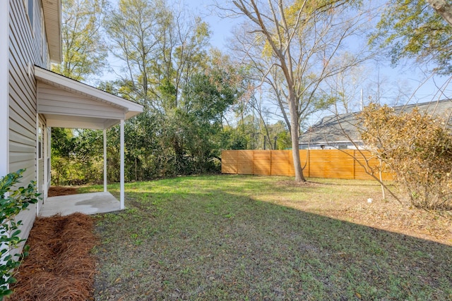 view of yard featuring a patio area and fence