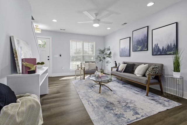 living area with visible vents, recessed lighting, baseboards, and wood finished floors