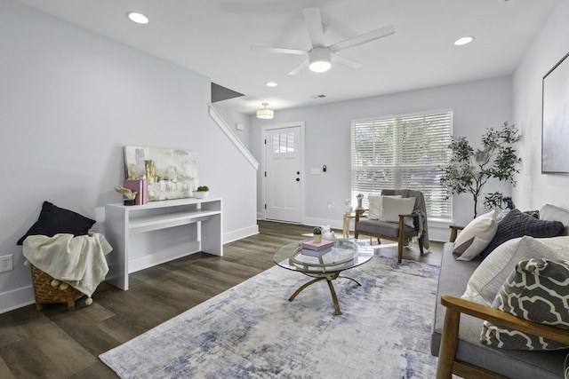 living room featuring a ceiling fan, recessed lighting, wood finished floors, and baseboards