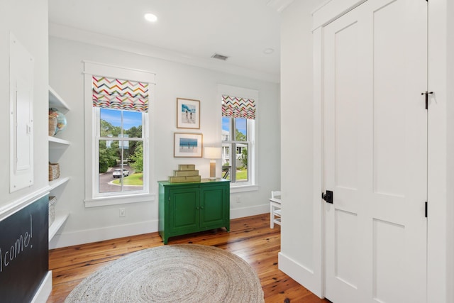 1809 Rushland Grove Ln, Johns Island, SC 29455 - living area featuring healthy amount of natural light, light wood-type flooring, recessed lighting, and crown molding