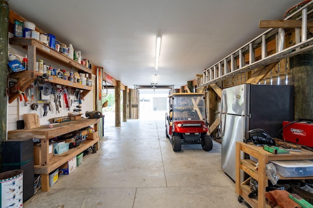 1809 Rushland Grove Ln, Johns Island, SC 29455 - garage with a workshop area and freestanding refrigerator