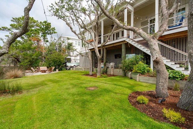 1809 Rushland Grove Ln, Johns Island, SC 29455 - view of green lawn featuring stairway and ceiling fan