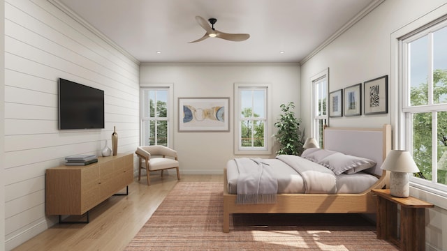 bedroom featuring multiple windows, ceiling fan, light hardwood / wood-style floors, and ornamental molding