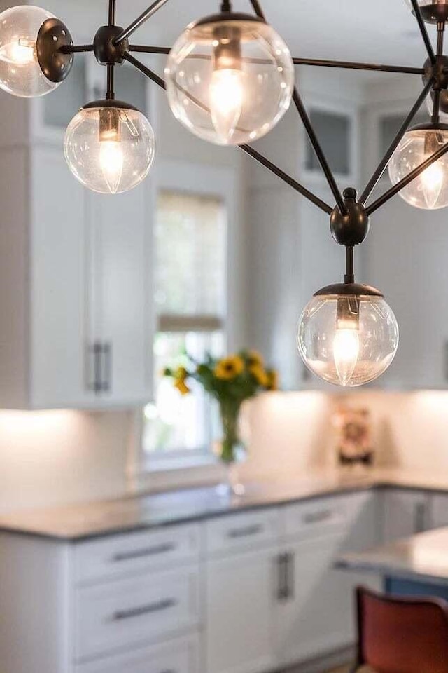 interior details featuring white cabinetry