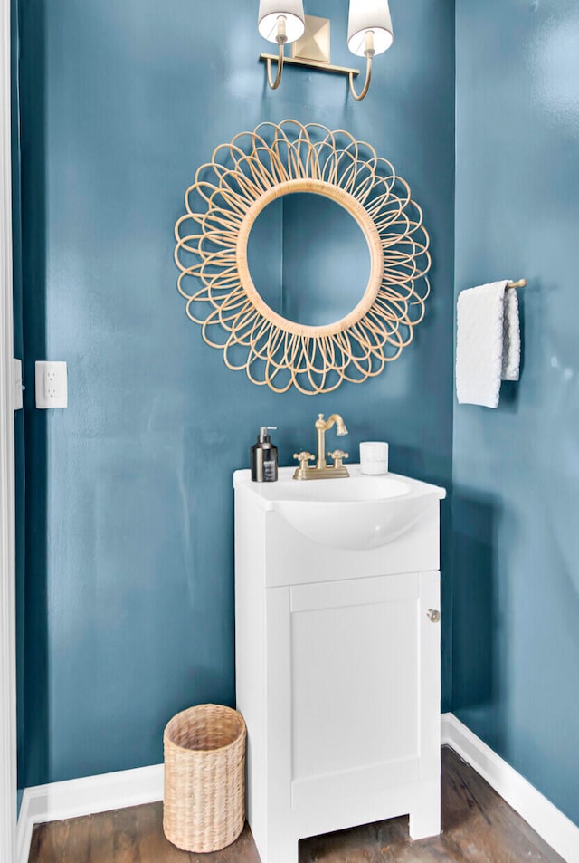 bathroom with hardwood / wood-style floors and vanity