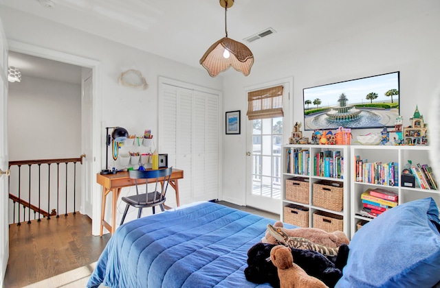 bedroom with hardwood / wood-style flooring and a closet