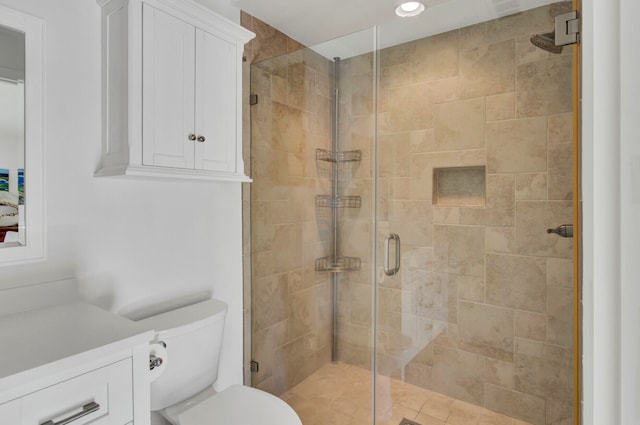 bathroom featuring an enclosed shower and toilet