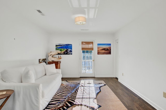 living room with dark hardwood / wood-style flooring