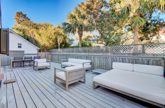 wooden terrace featuring outdoor lounge area