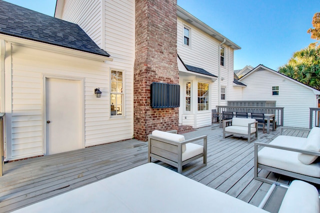 wooden deck with an outdoor hangout area