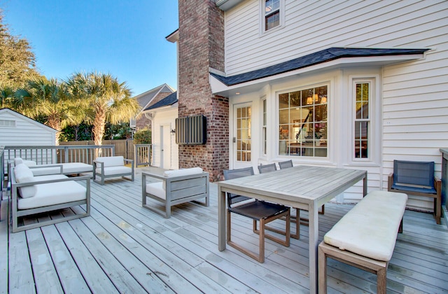 wooden deck with an outdoor hangout area