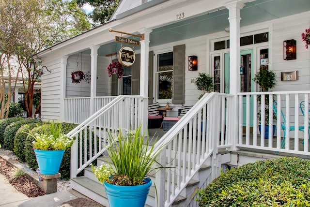 view of exterior entry with covered porch