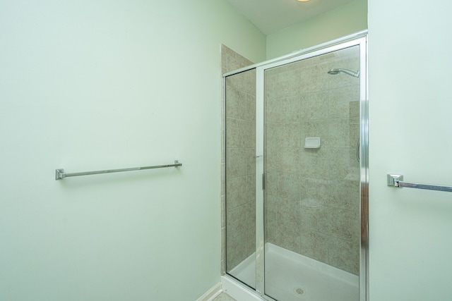 bathroom featuring a shower stall