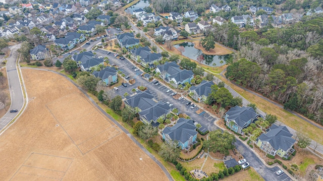 birds eye view of property featuring a water view and a residential view