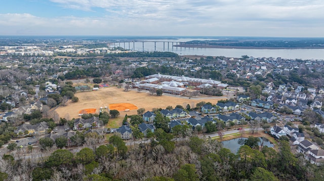 bird's eye view with a residential view and a water view