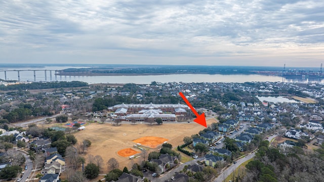 birds eye view of property with a water view and a residential view