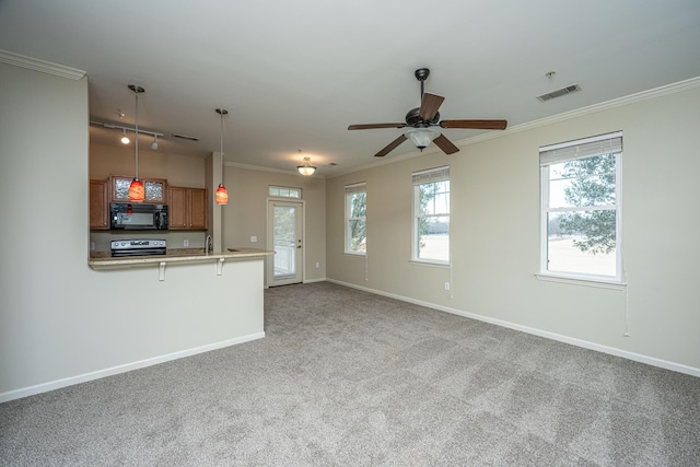 unfurnished living room with visible vents, crown molding, and baseboards