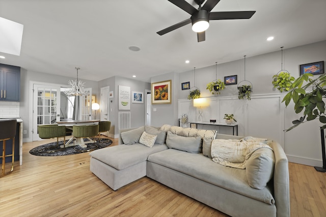 2605 Mona Ave, Charleston, SC 29414 - living room with recessed lighting, light wood-style flooring, ceiling fan, and a chandelier