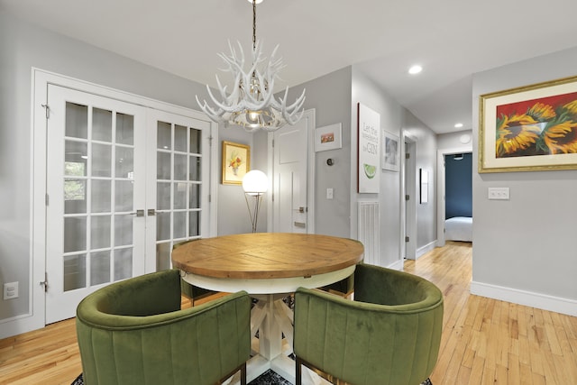 2605 Mona Ave, Charleston, SC 29414 - dining space with a chandelier, light wood-style flooring, french doors, baseboards, and recessed lighting