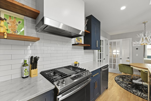 2605 Mona Ave, Charleston, SC 29414 - kitchen featuring open shelves, stainless steel appliances, wall chimney range hood, and blue cabinetry