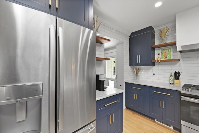 2605 Mona Ave, Charleston, SC 29414 - kitchen with appliances with stainless steel finishes, blue cabinetry, open shelves, tasteful backsplash, and recessed lighting