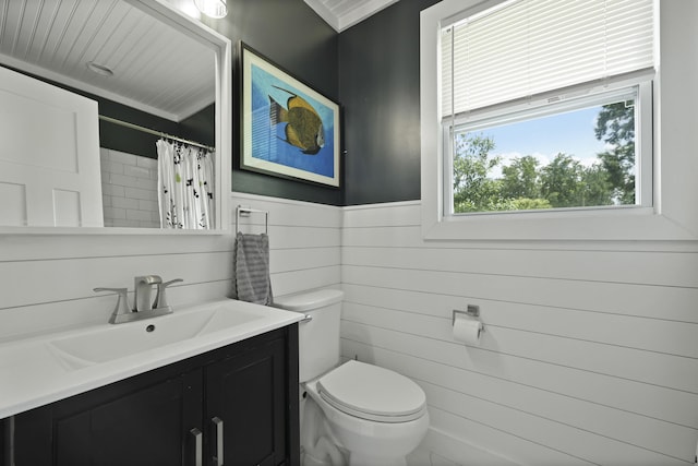 2605 Mona Ave, Charleston, SC 29414 - bathroom featuring toilet, vanity, a wainscoted wall, and a shower with curtain