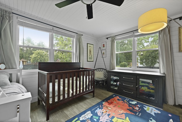 2605 Mona Ave, Charleston, SC 29414 - bedroom featuring wood finished floors, a crib, and multiple windows