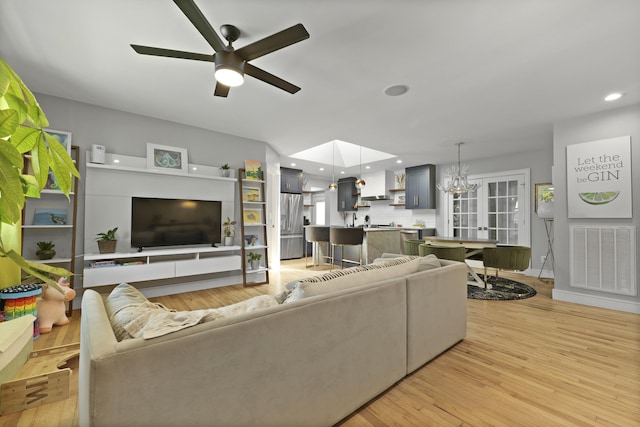 2605 Mona Ave, Charleston, SC 29414 - living room featuring a ceiling fan, light wood-style floors, recessed lighting, and a chandelier