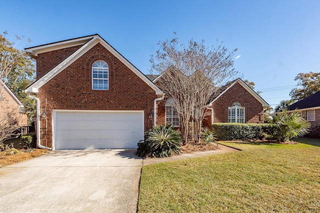 view of property with a garage and a front yard