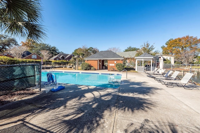 view of swimming pool featuring a gazebo and a patio area