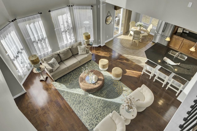 living room with baseboards and wood finished floors