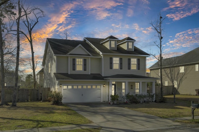 view of front of home featuring a porch, fence, driveway, and an attached garage