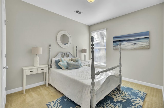 bedroom featuring light colored carpet, visible vents, and baseboards