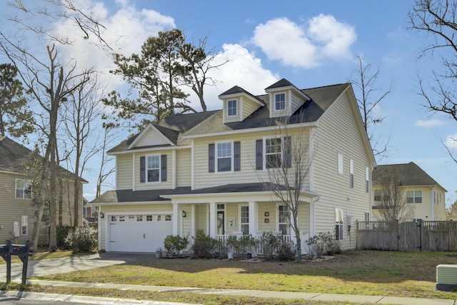 view of front of home with central AC unit, a porch, fence, driveway, and a front yard