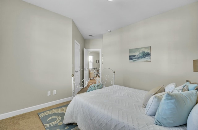 carpeted bedroom featuring visible vents and baseboards