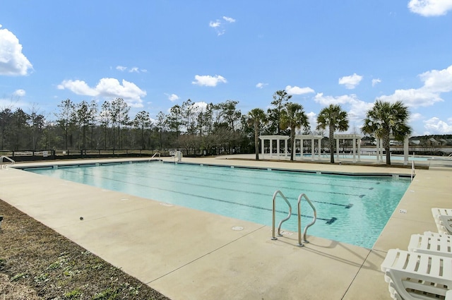 community pool featuring a patio and a pergola