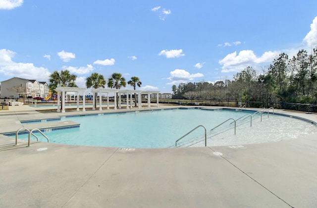 community pool with a pergola