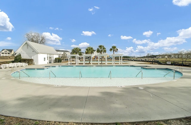 community pool featuring a patio area and a pergola