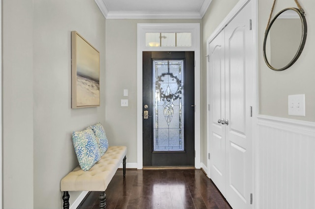 entrance foyer featuring ornamental molding and dark wood-type flooring