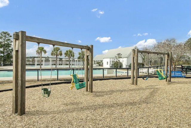 community playground featuring a community pool