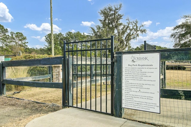 view of gate featuring fence