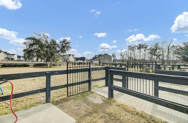 exterior space with fence and a residential view