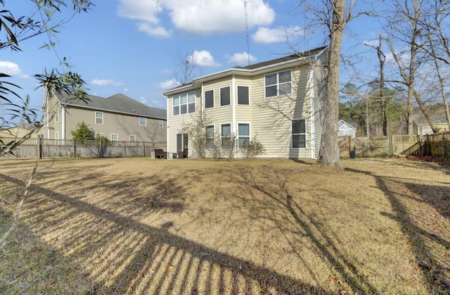 rear view of property with a lawn, a fenced backyard, and central air condition unit