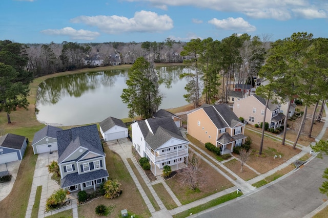 birds eye view of property featuring a water view and a residential view