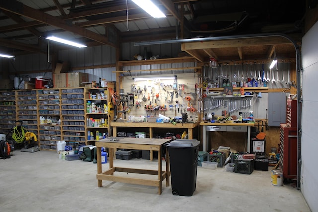 garage featuring a workshop area and metal wall