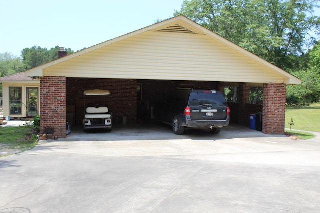 exterior space with a carport and concrete driveway