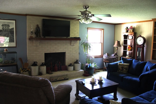 living area with a ceiling fan, carpet, a textured ceiling, crown molding, and a fireplace