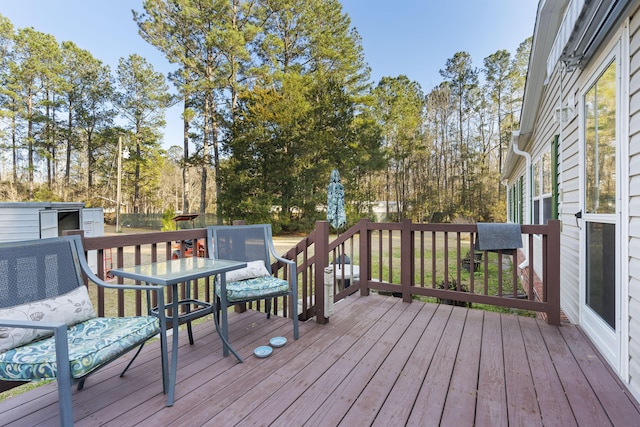 deck with outdoor dining area