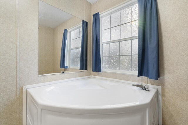 full bath featuring a bath